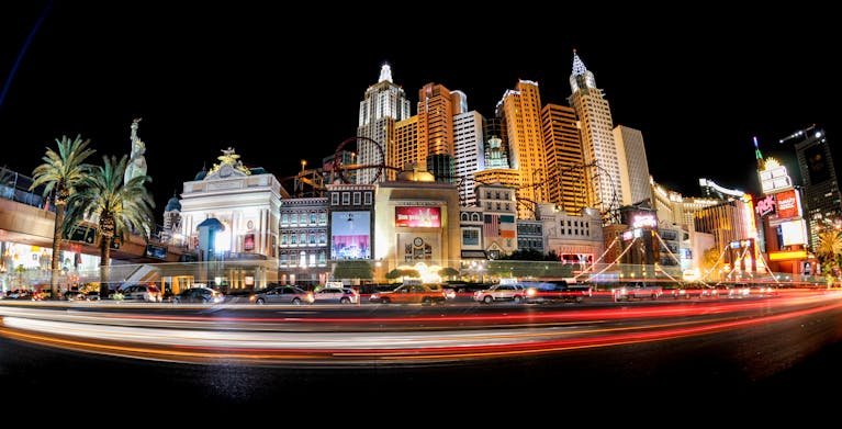 Illuminated cityscape of the Las Vegas Strip featuring iconic architecture and dazzling lights at night.